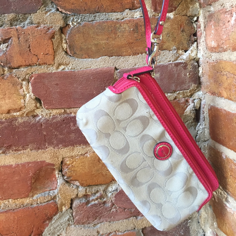 Coach wristlet. Pink leather detail and interior!